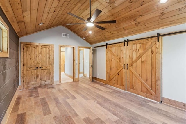 78 Pocola Ct, Ellijay, GA 30536 - interior space with wood finished floors, a ceiling fan, a barn door, and visible vents