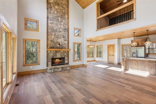 78 Pocola Ct, Ellijay, GA 30536 - unfurnished living room with high vaulted ceiling, baseboards, wood ceiling, and wood finished floors