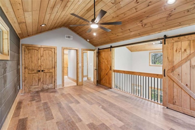 78 Pocola Ct, Ellijay, GA 30536 - additional living space featuring wood ceiling, visible vents, vaulted ceiling, wood finished floors, and a barn door