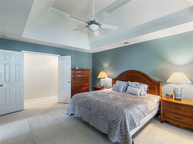 3580 Treeline Pass NE, Roswell, GA 30075 - bedroom with light carpet, a tray ceiling, and a ceiling fan