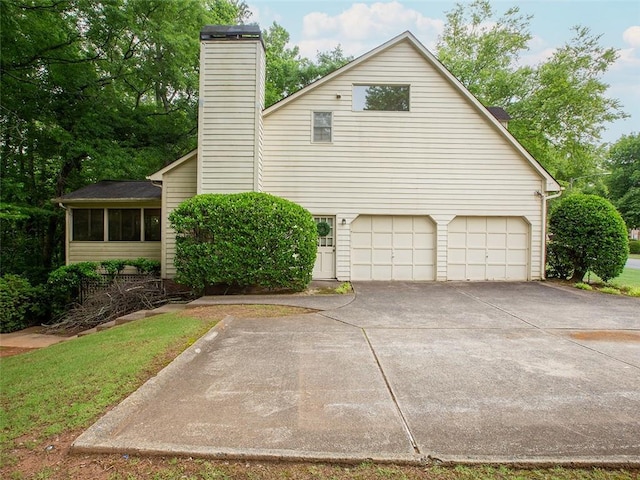 3580 Treeline Pass NE, Roswell, GA 30075 - view of side of property featuring a chimney, driveway, and an attached garage