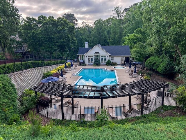 3580 Treeline Pass NE, Roswell, GA 30075 - community pool featuring a patio, a community hot tub, an outbuilding, and a forest view