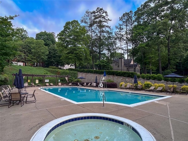 3580 Treeline Pass NE, Roswell, GA 30075 - community pool featuring a patio area, view of scattered trees, and a community hot tub
