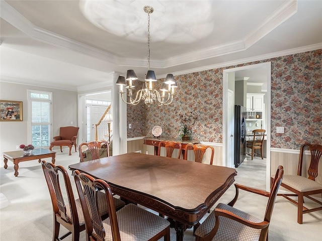 3580 Treeline Pass NE, Roswell, GA 30075 - dining area with light colored carpet, wainscoting, a tray ceiling, a chandelier, and crown molding