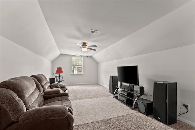 carpeted living room featuring ceiling fan and vaulted ceiling