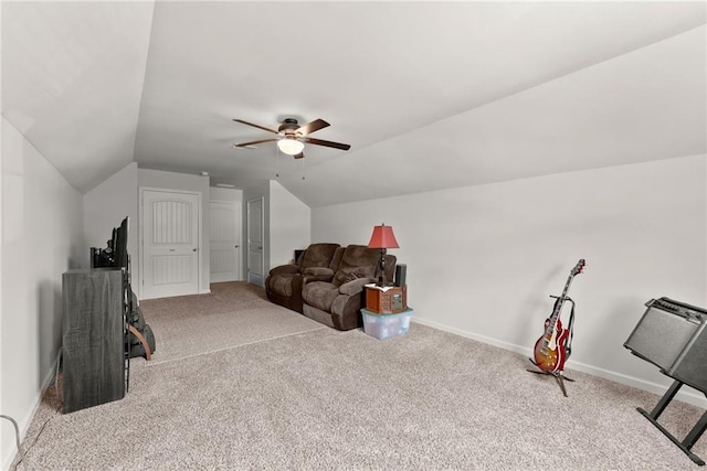 interior space featuring ceiling fan, light carpet, and vaulted ceiling