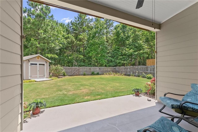 view of yard with a storage unit and a patio area