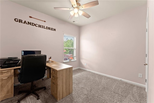 office with light carpet and ceiling fan