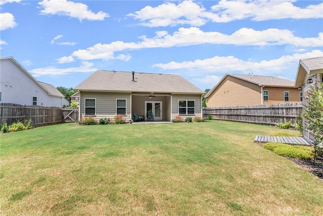 back of property featuring a patio and a yard