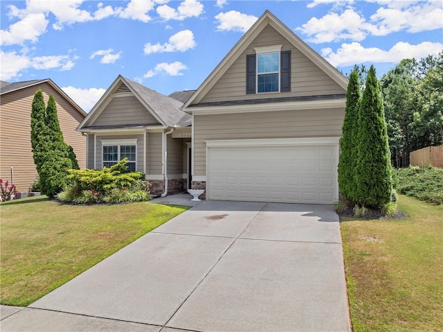 view of front of house with a front lawn and a garage