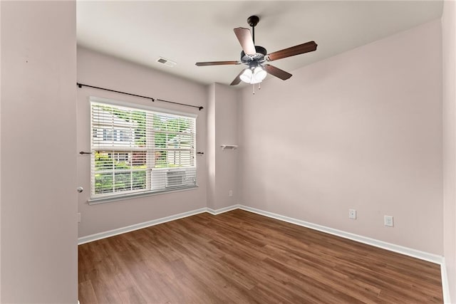 empty room featuring hardwood / wood-style floors and ceiling fan