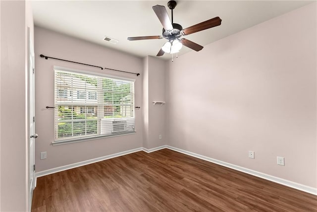 unfurnished room featuring ceiling fan and dark hardwood / wood-style floors