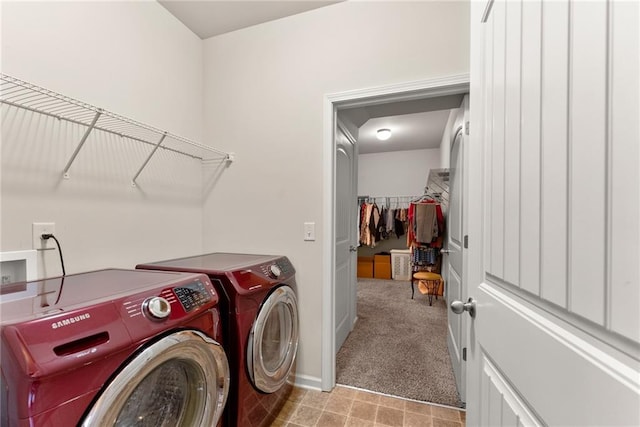 laundry room featuring washer and dryer and light colored carpet