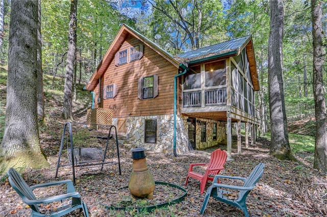 rear view of house with a sunroom