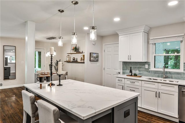 437 Valley Brook Dr NE, Atlanta, GA 30342 - kitchen featuring a center island, white cabinetry, dark wood-type flooring, decorative light fixtures, and recessed lighting