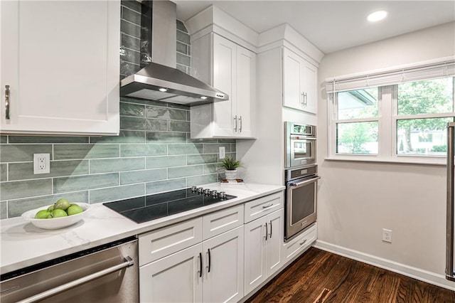 437 Valley Brook Dr NE, Atlanta, GA 30342 - kitchen with wall chimney exhaust hood, stainless steel appliances, dark wood finished floors, white cabinetry, and tasteful backsplash
