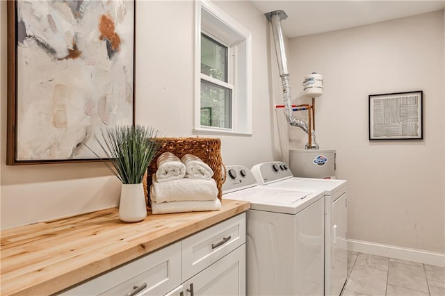 437 Valley Brook Dr NE, Atlanta, GA 30342 - washroom featuring separate washer and dryer, light marble finish flooring, cabinet space, and water heater