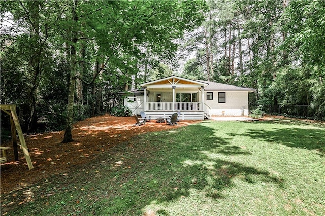 437 Valley Brook Dr NE, Atlanta, GA 30342 - back of property featuring a porch and a lawn