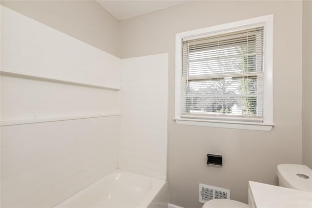 bathroom with visible vents, vanity, toilet, and shower / bathtub combination