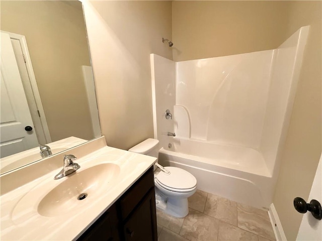 full bathroom with toilet, vanity,  shower combination, baseboards, and tile patterned flooring