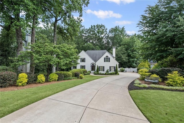 3648 Sope Creek Farm SE, Marietta, GA 30067 - view of front of home with a front lawn, driveway, and a chimney