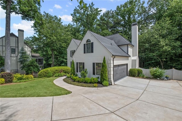 3648 Sope Creek Farm SE, Marietta, GA 30067 - view of front of property featuring driveway, a garage, stucco siding, and a chimney