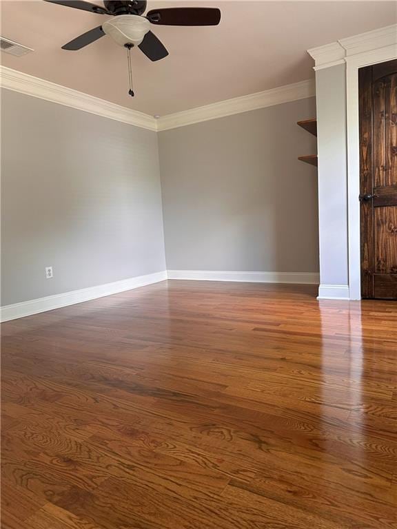 1055 Worthington Hills Dr, Roswell, GA 30076 - spare room featuring crown molding, baseboards, ceiling fan, and wood finished floors
