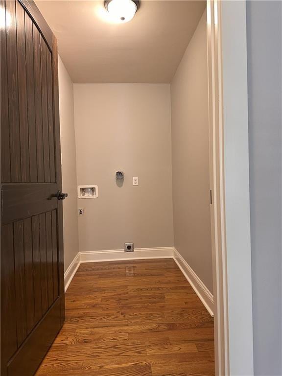 1055 Worthington Hills Dr, Roswell, GA 30076 - laundry area with electric dryer hookup, washer hookup, wood finished floors, and baseboards