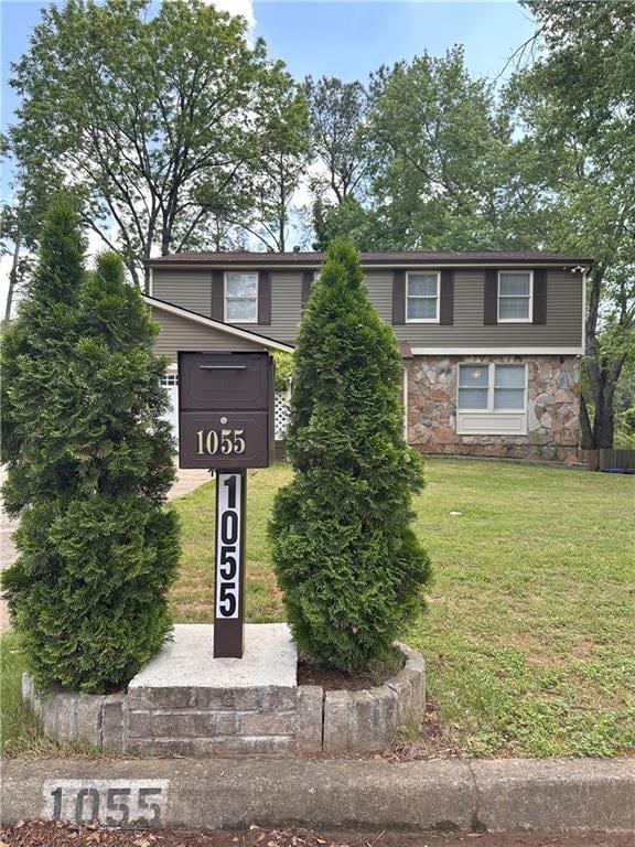 1055 Worthington Hills Dr, Roswell, GA 30076 - view of front of house featuring stone siding and a front lawn