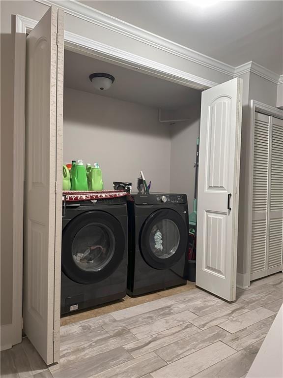 1055 Worthington Hills Dr, Roswell, GA 30076 - laundry area with separate washer and dryer, light wood-style floors, and crown molding