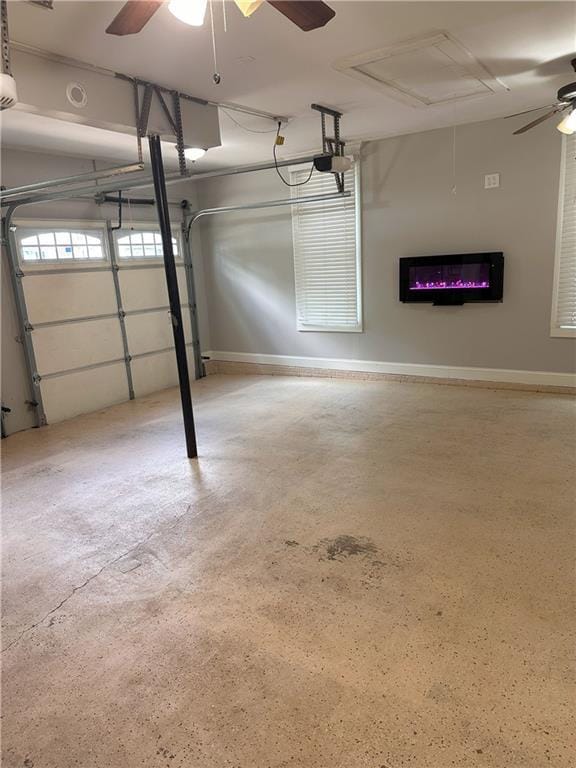 1055 Worthington Hills Dr, Roswell, GA 30076 - garage with a ceiling fan and baseboards