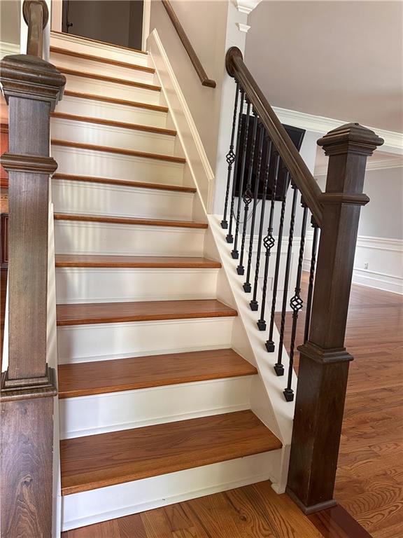 1055 Worthington Hills Dr, Roswell, GA 30076 - staircase featuring wood finished floors