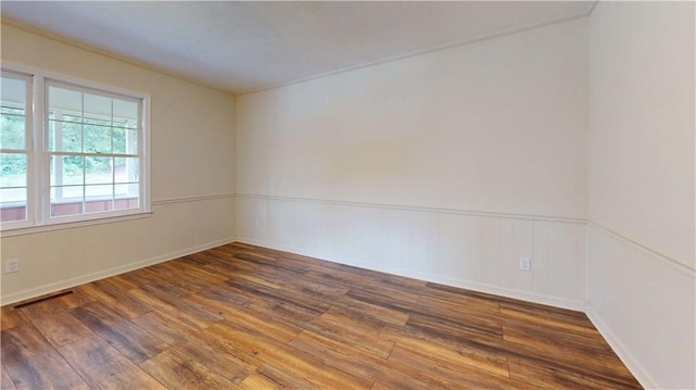 25 Forrest Ln, Cartersville, GA 30121 - spare room featuring wood finished floors and wainscoting
