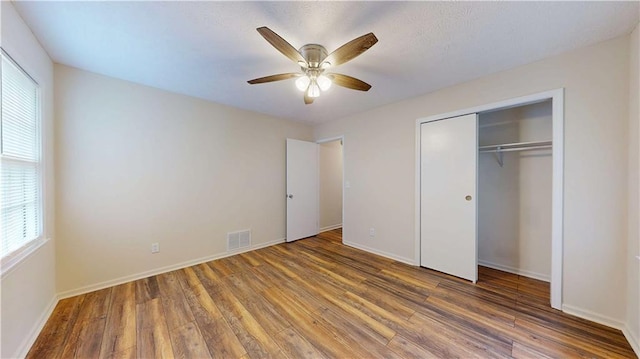 25 Forrest Ln, Cartersville, GA 30121 - unfurnished bedroom with wood finished floors, a closet, and a ceiling fan