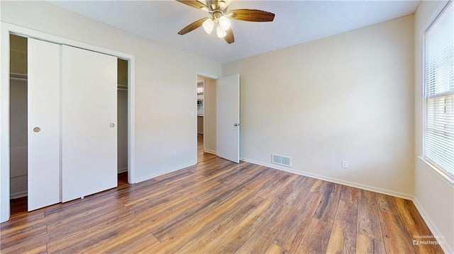 25 Forrest Ln, Cartersville, GA 30121 - unfurnished bedroom featuring wood finished floors, a closet, and ceiling fan