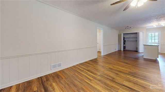25 Forrest Ln, Cartersville, GA 30121 - spare room with a textured ceiling, wood finished floors, ceiling fan, and ornamental molding