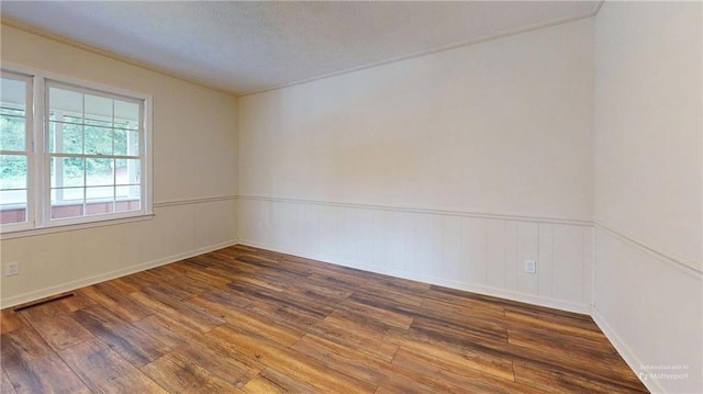 25 Forrest Ln, Cartersville, GA 30121 - empty room featuring wood-type flooring, wainscoting, and ornamental molding