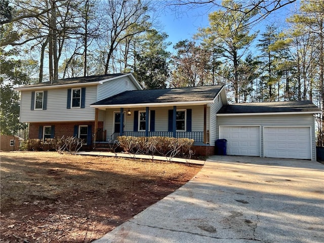 tri-level home with a garage and covered porch