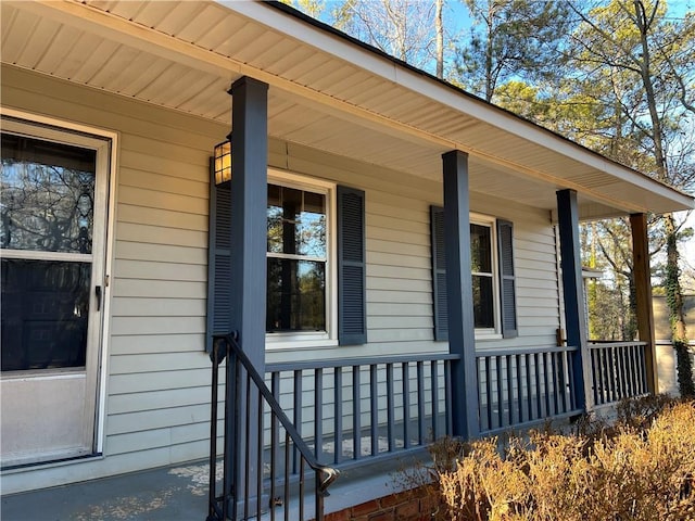 view of side of home with covered porch