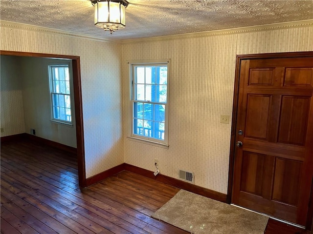 entryway featuring dark hardwood / wood-style flooring and a textured ceiling