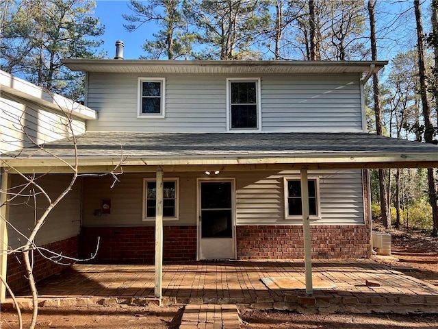 exterior space with a wooden deck and central AC