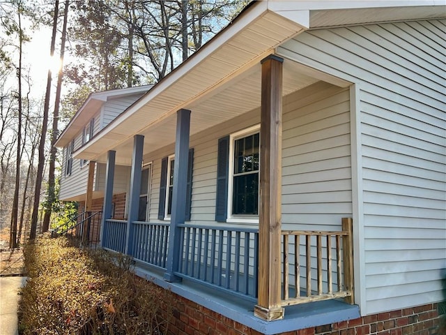 view of side of home with a porch