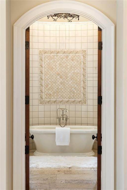 bathroom with a freestanding tub