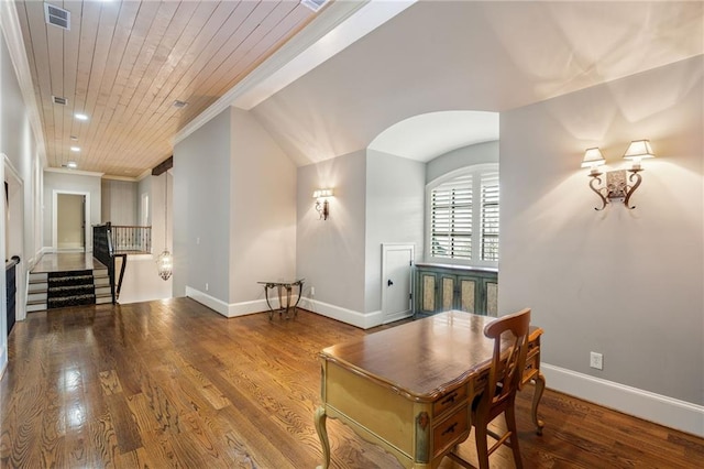 interior space with baseboards, visible vents, wood ceiling, wood finished floors, and crown molding