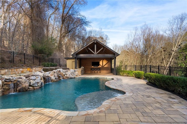 view of swimming pool featuring exterior fireplace, a patio area, fence, and a fenced in pool