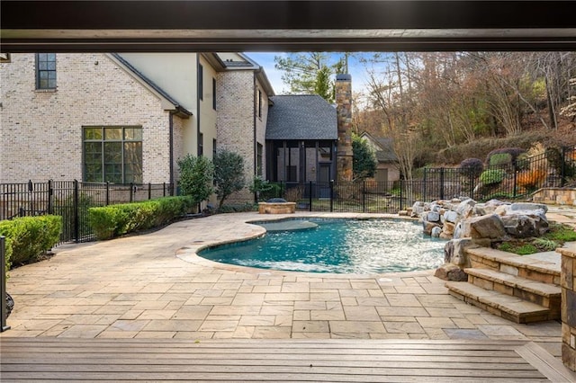 view of pool featuring a patio area, fence, and a fenced in pool