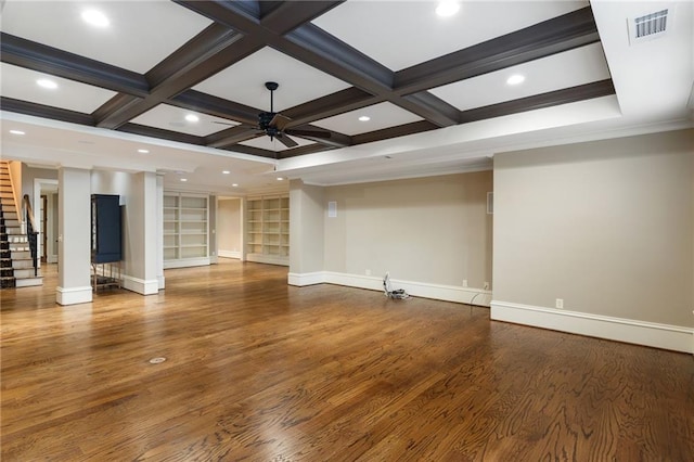 unfurnished living room featuring visible vents, stairway, a ceiling fan, wood finished floors, and coffered ceiling