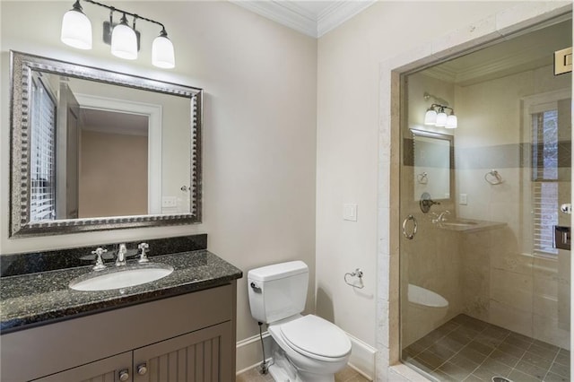 full bathroom with baseboards, toilet, crown molding, vanity, and a shower stall