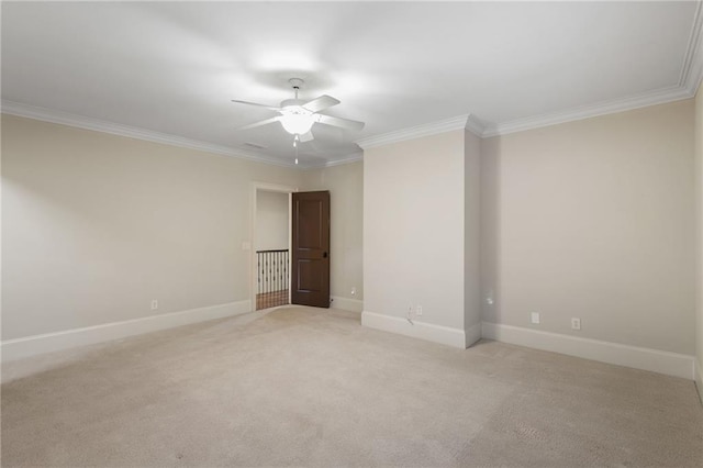 unfurnished room featuring ornamental molding, ceiling fan, and baseboards