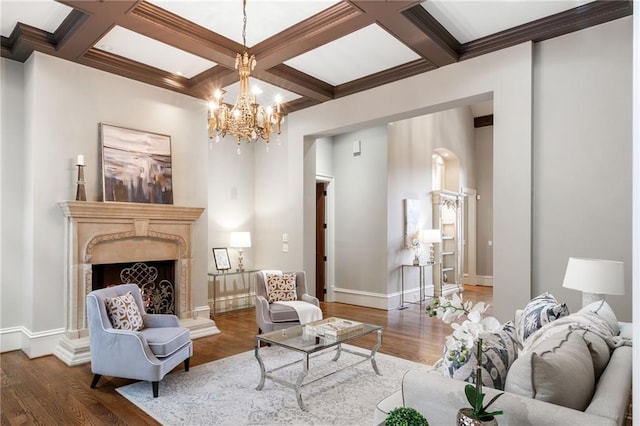 living room with a premium fireplace, coffered ceiling, baseboards, beam ceiling, and dark wood finished floors